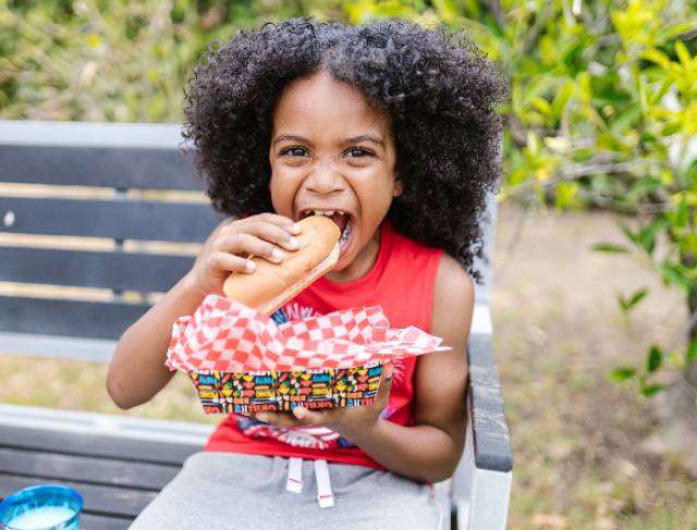 woman eating hot dogs